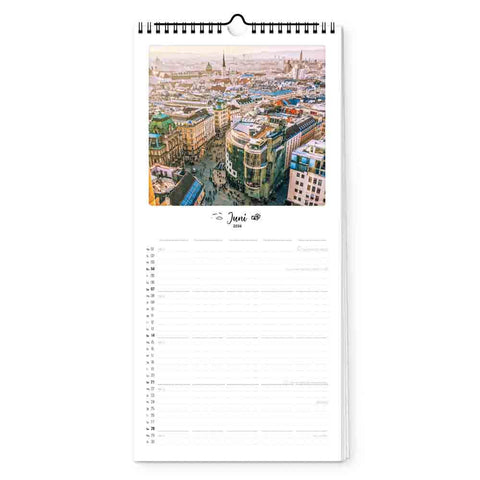Luftaufnahme eines prunkvollen Gebäudes in einer Stadt an der Spitze der Pickmotion Wien - Planer (Format 15x40), geöffnet bis Juni.