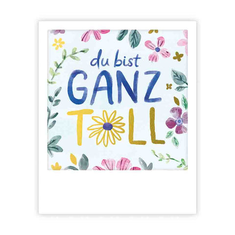 Die fröhliche Postkarte "du bist ganz toll" von Pickmotion zeigt eine bunte Blumenbordüre im Sofortbild-Stil mit deutschem Text in der Mitte.