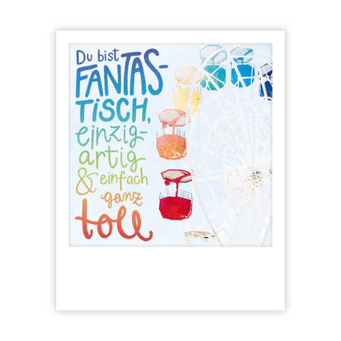 Pickmotion's "du bist fantastisch": Ein farbenfrohes Riesenrad mit deutschem Text, der jemanden als fantastisch, einzigartig und großartig feiert - ideal für Postkarten oder Instagram-Fotografen, die auf der Suche nach außergewöhnlichen Motiven sind.