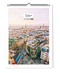 Der Pickmotion Wien - Kalender (Format 30x40) 2026 zeigt großformatige Stadtmotive, die prunkvolle Gebäude und moderne Wahrzeichen Wiens unter einem sanften Pastellhimmel vereinen.